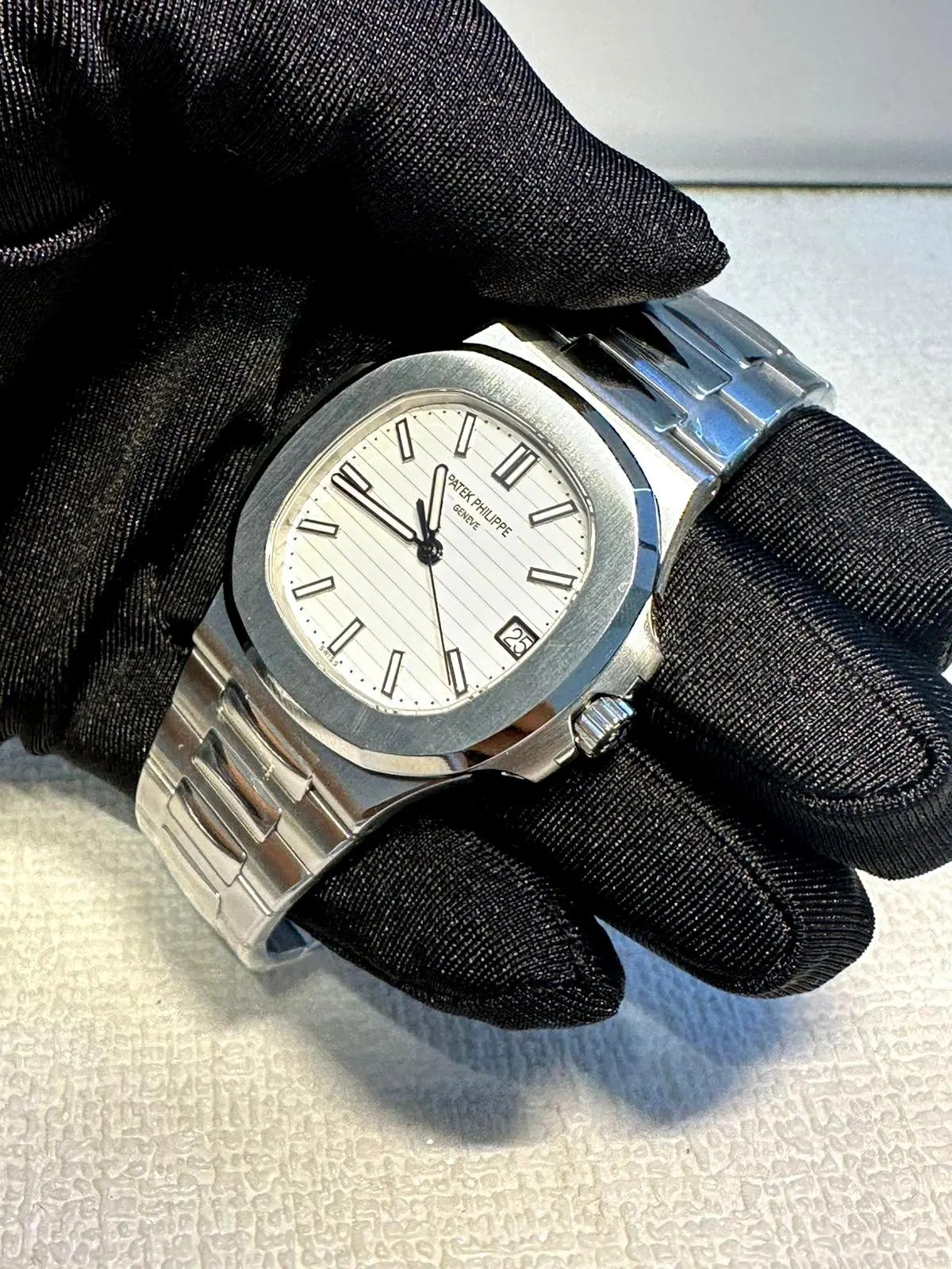 PATEK PHILIPPE Patek Philippe Nautilus Reference white piano dial.